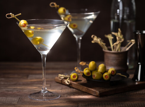 Martini cocktail with olives on a bamboo pick