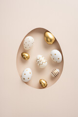 Happy Easter vertical celebration greeting featuring gold and white decorated eggs arranged in a...