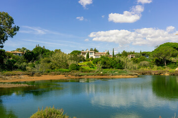 Obraz premium Luxury Villas Overlooking Lagoon in Quinta do Lago, Algarve, Portugal