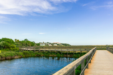 Fototapeta premium Wooden Boardwalk in Quinta do Lago, Algarve, Portugal on a Sunny Day