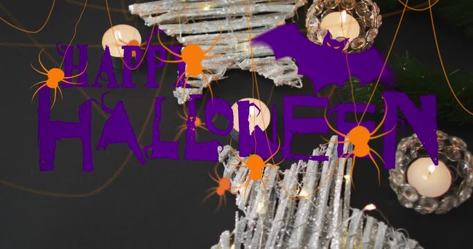 Animation of happy halloween text over decorations