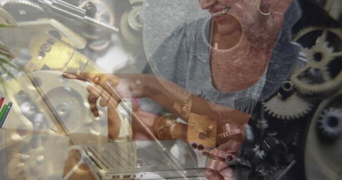 Composite video of caucasian businessman and businesswoman against close up of clock mechanism