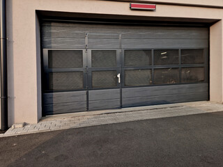sectional garage door with some pretty specific features. Specifically, it has integrated windows light ventilation pass-through wicket, built right into main panel.​clever setup it lets you walk in a © Michal