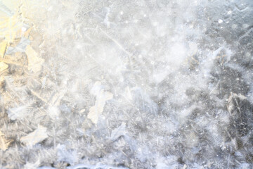 Fototapeta premium white winter background, frosty patterns on glass, abstract backdrop of ice and snow crystals in a blur