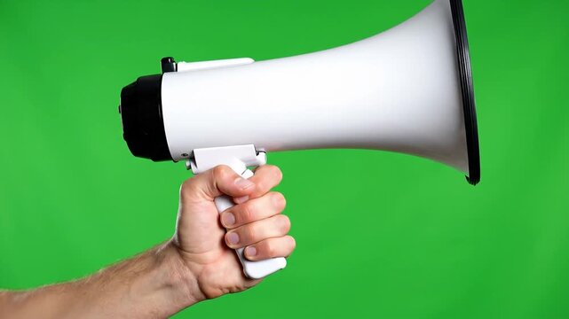 Hand holding megaphone for announcement on green screen background