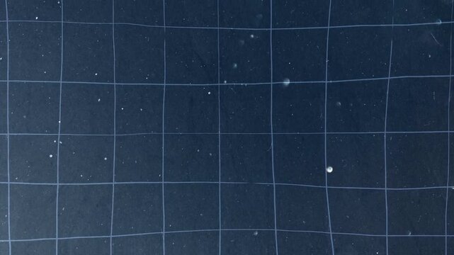 Water droplets floating through a grid system