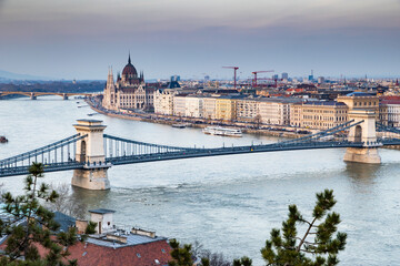 Obraz premium panorama view at the parliament with Danube river in Budapest