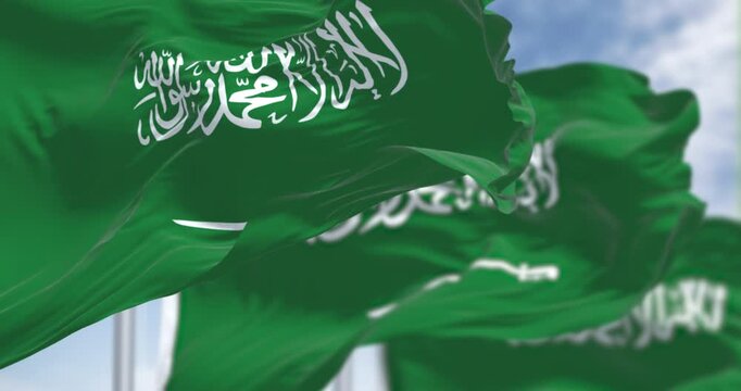 Saudi Arabian flags with Arabic calligraphy waving in the wind. 3D render