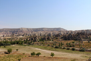 Fototapeta premium Arid landscape Rose Valley Goreme August 2024 Summer view of volcanic tuff formations