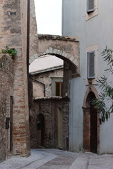 Fototapeta premium View along a narrow back street in an old Italian town
