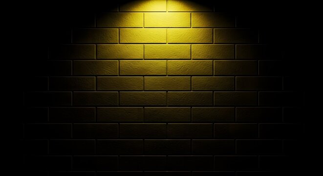 A single spotlight shining on a brick wall in darkness