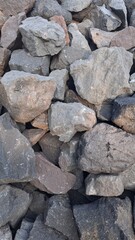 Fototapeta premium Pile of Natural Stones and Rocks for Construction Background