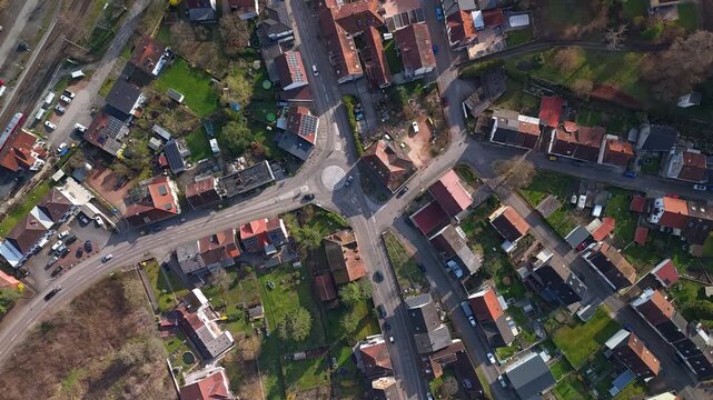 Aerial Timelapse of Busy Village Intersection with Cars and Train