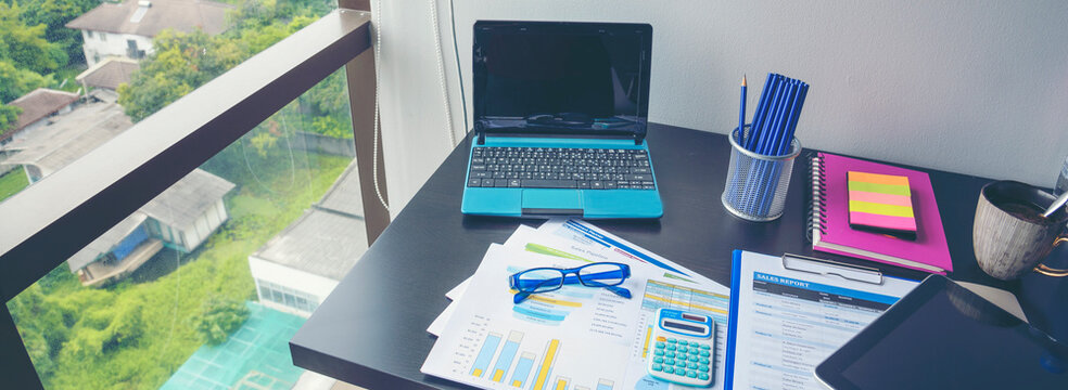 Banner Business Graphs charts office desk with copy space. Surfing internet online technology lifestyle. Banner Financial Planning Account Database Report. Technology lifestyle. Finance Excel graph