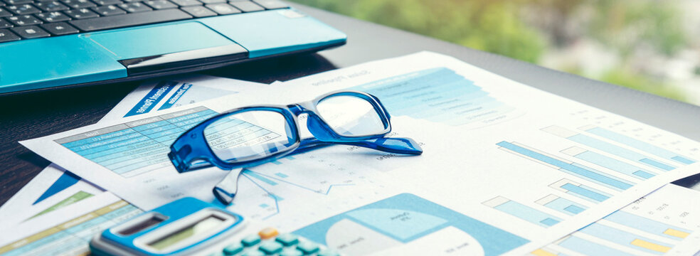 Banner Business Graphs charts office desk with copy space. Surfing internet online technology lifestyle. Banner Financial Planning Account Database Report. Technology lifestyle. Finance Excel graph