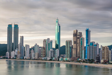 Obraz premium Skyline With High Rise Buildings in Front of the Beach With Dramatic Sky in Balneario Camboriu City in Brazil