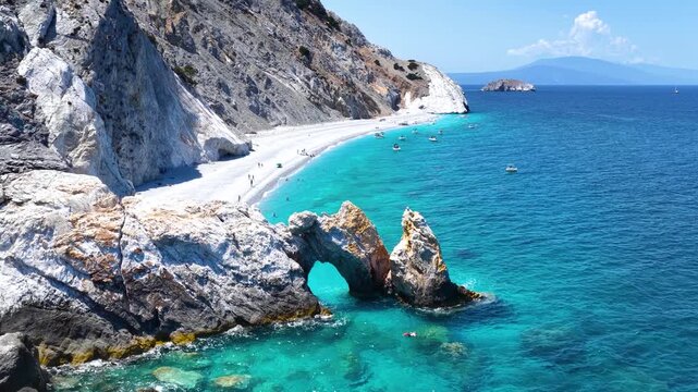 Aerial view of the beautiful Lalaria beach at Skiathos Island, Sporades, Greece, with the natural rock arch and turquoise shining sea
