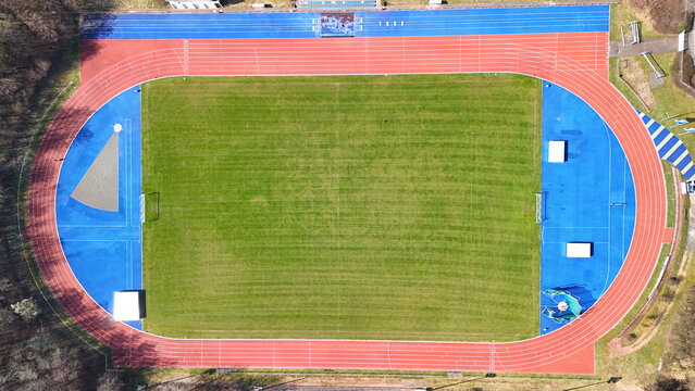 Aerial View of Sports Facility with Running Track and Multi-Sport Courts	
