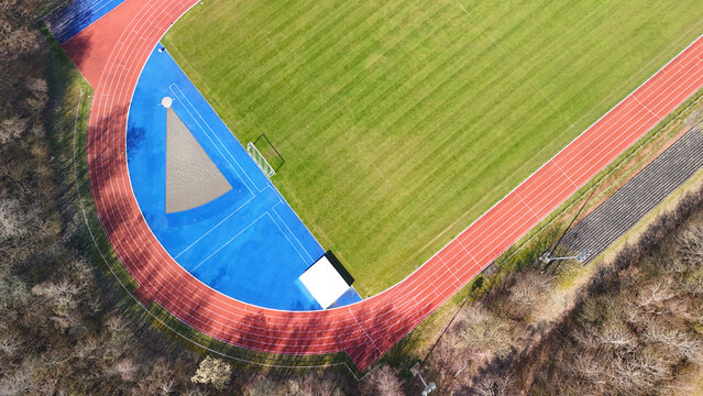 Aerial View of Sports Facility with Running Track and Multi-Sport Courts	
