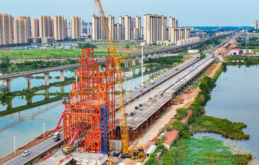 Wuhan Bridge Construction Site Aerial View with City Skyline © NguyenMinh
