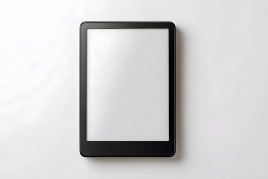 A modern e reader device with a blank screen rests on a plain white surface