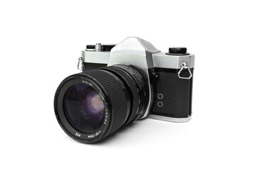 Fototapeta premium Classic silver and black Vintage 35mm SLR Film analog Camera with zoom lens isolated on white background. Equipment Photography, nostalgia, and retro technology design concepts.