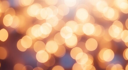 Obraz premium Golden bokeh lights against a blurred background.