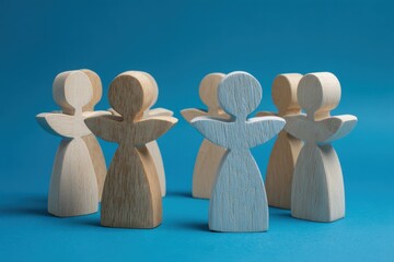 Obraz premium Angelic Union: A group of wooden figures stand united, exuding a sense of peace and harmony. Their arms outstretched, they symbolize openness and connection.