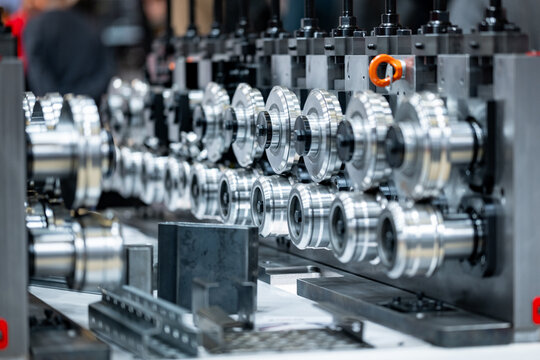 Industrial roll forming machine creating metal profiles in a factory
