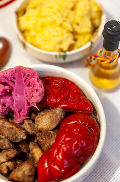 romanian traditional winter season meal with polenta mamaliga fried pork scraps and pickled vegetables