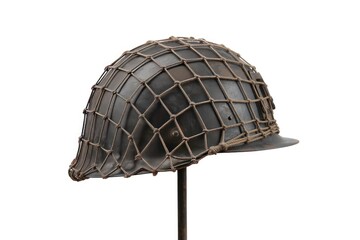 Fototapeta premium Vintage World War II US Army M1 steel combat helmet with camouflage netting, military historical artifact on white background