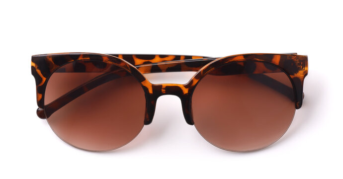 Folded spotted brown framed sunglasses