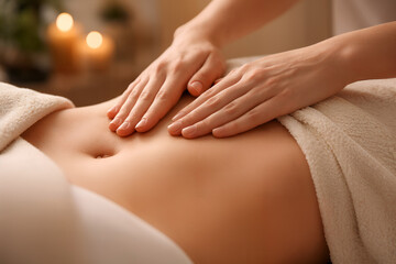 Fototapeta premium Massage Session: Close-up of hands giving a gentle abdominal massage, promoting relaxation and well-being.