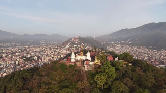 Aerial Orbit View Swayambhunath Stupa Kathmandu Nepal 
Morning Drone Shot Buddha Eyes Hill Steps Valley 
Himalaya Mountains Clockwise