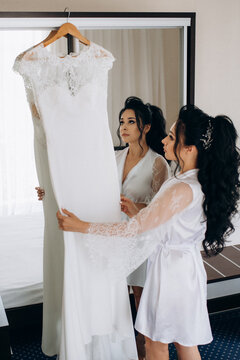 preparations for the bride with the dressing of the wedding dress