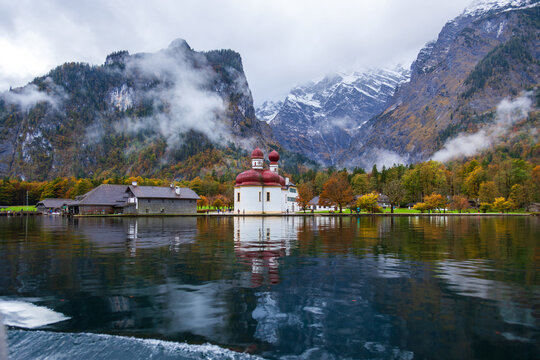 St. Bartholomew Church in Konigssee, Germany, with its beautiful lake and mountain scenery in autumn.