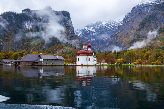 St. Bartholomew Church in Konigssee, Germany, with its beautiful lake and mountain scenery in autumn.
