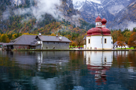 St. Bartholomew Church in Konigssee, Germany, with its beautiful lake and mountain scenery in autumn.