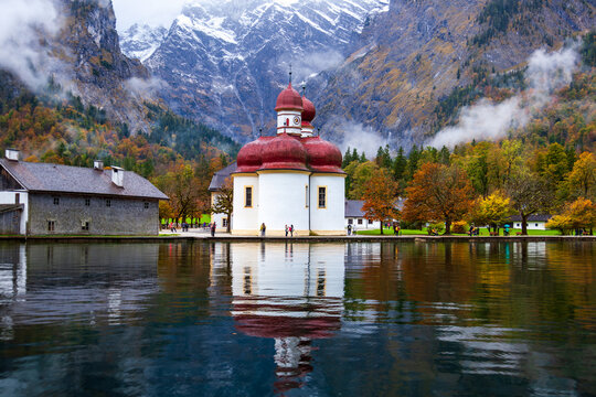 St. Bartholomew Church in Konigssee, Germany, with its beautiful lake and mountain scenery in autumn.