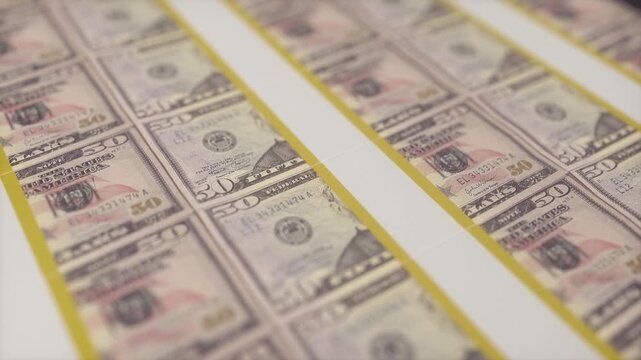 Printed Sheets of Fifty Dollar Bills in Soft Perspective View