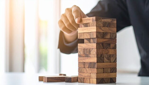 Building blocks tower game strategy concentration balance construction challenge concept for risk assessment and planning.