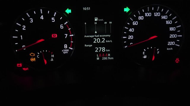 Car Dashboard Instrument Cluster Close-Up at Night, Illuminated Speedometer, Tachometer and Fuel Economy Display, Modern Vehicle Driving Interface, Automotive Technology 4K Footage
