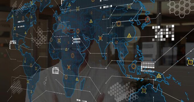 Senior male business exec uncrossing arms as holographic map fading in, reviewing Asia market data
