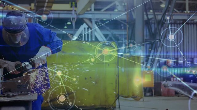 Welder activating grinder, deburring and sparking while nodes linking across welder, yellow curtain