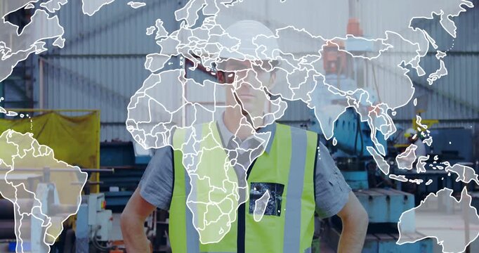 Standing worker wearing hi-vis vest and white helmet in metal shop with animated map overlay