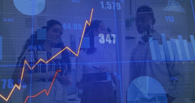 Center woman tapping tablet activating data charts, left woman pointing while team analyzing spikes