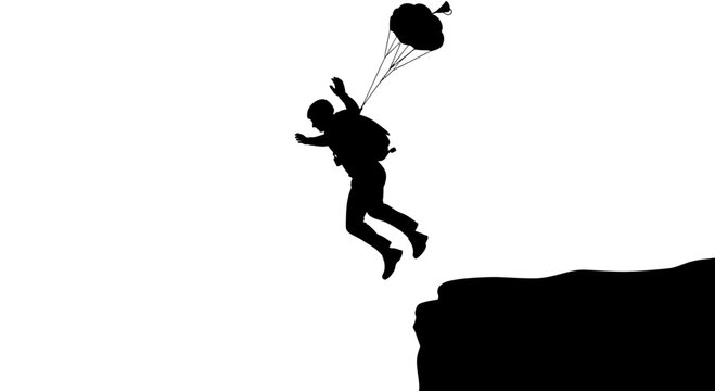 Silhouette of a Base Jumper Leaping from a Cliff