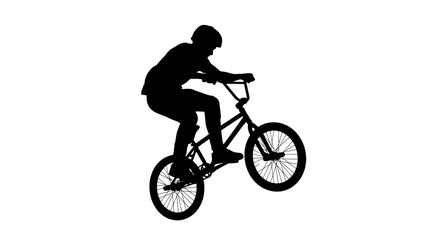 Fototapeta premium Silhouette of a BMX Rider Performing a Wheelie Trick