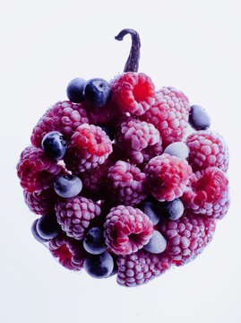 Fresh and frozen  raspberries and blueberries  with vanilla for healthy and creative dessert  