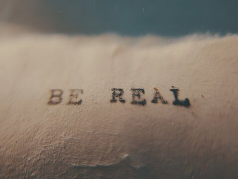 &ldquo;Be Real&rdquo; typewriter extreme macro, authenticity, honesty and true self expression concept
